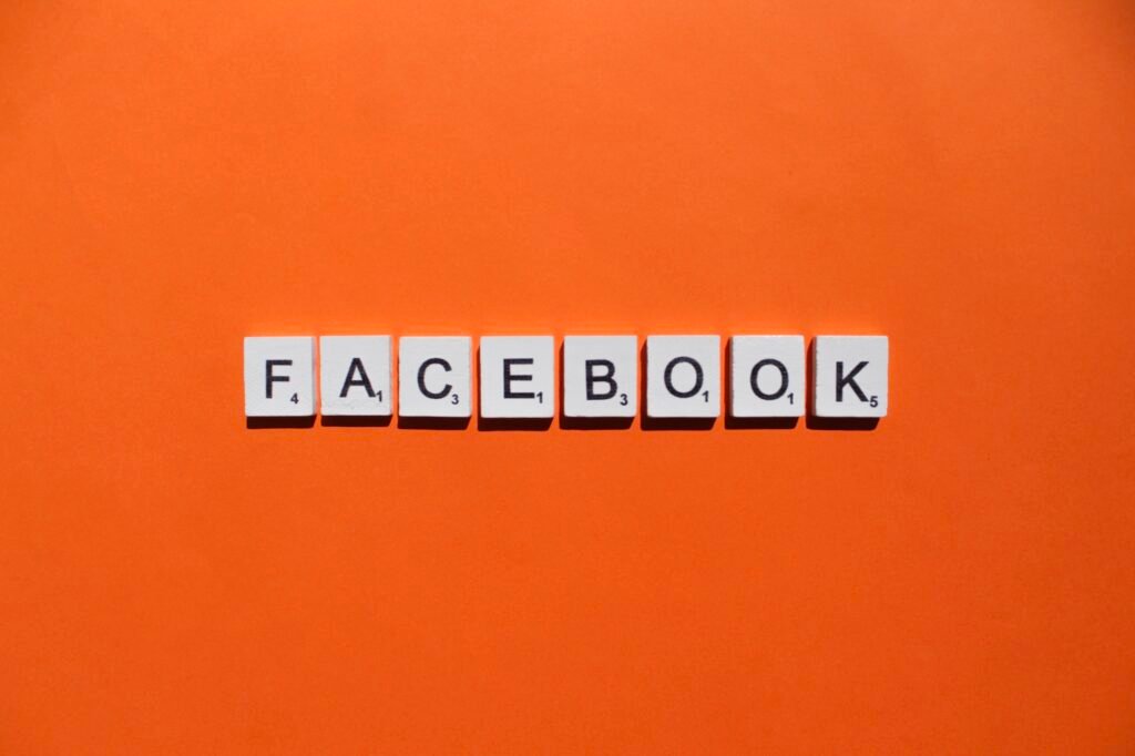 Facebook scrabble letters word on a orange background